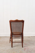 Load image into Gallery viewer, Antique Petite Walnut Accent Chair with Hand-tied Cane Seat + Back with Bobbin Legs