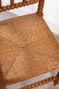 Load image into Gallery viewer, Antique Bobbin Rush Seat Corner Chair
