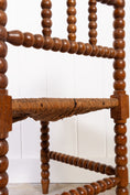 Load image into Gallery viewer, Antique Bobbin Rush Seat Corner Chair
