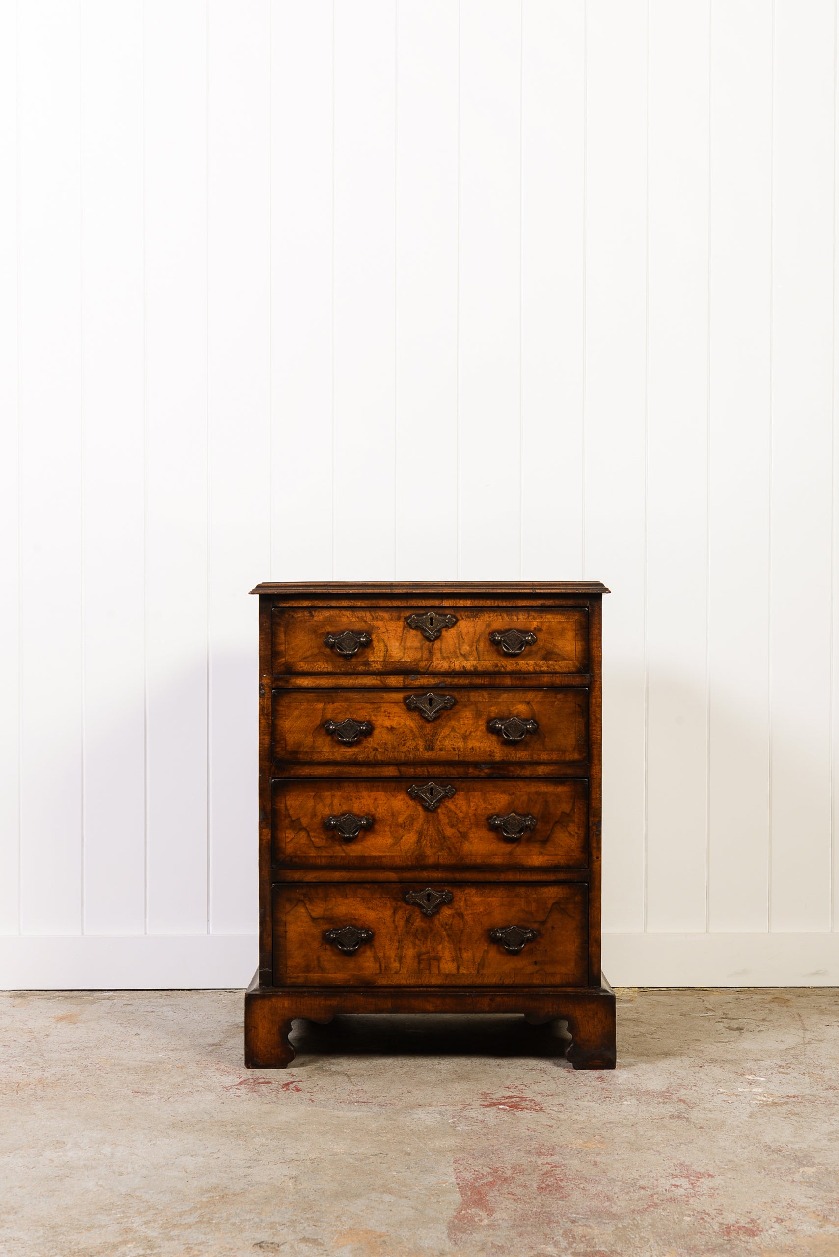 English Book-Match Walnut Four Drawer Bachelor's Chest