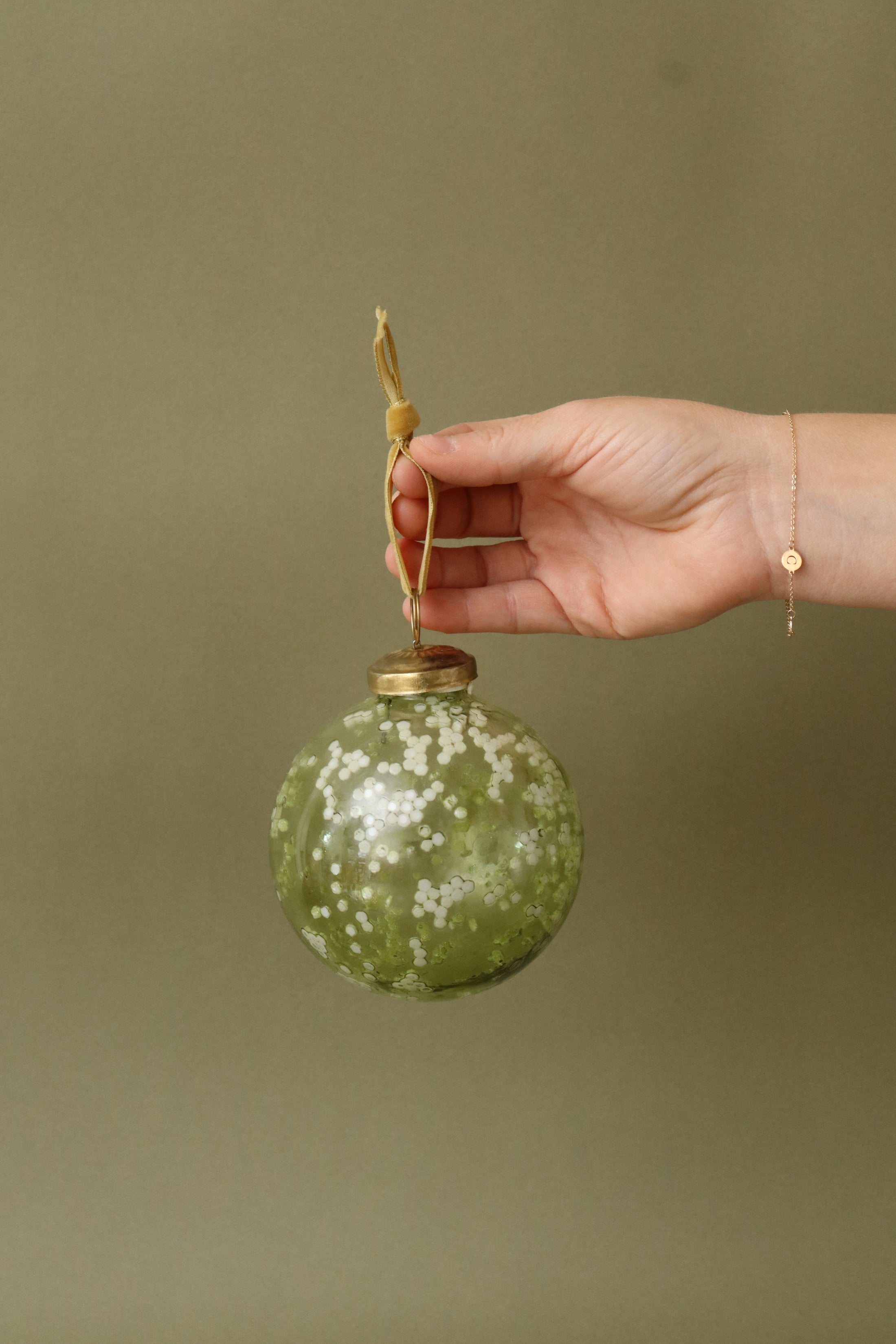 Green Glass Ball Ornament with Cream Pattern