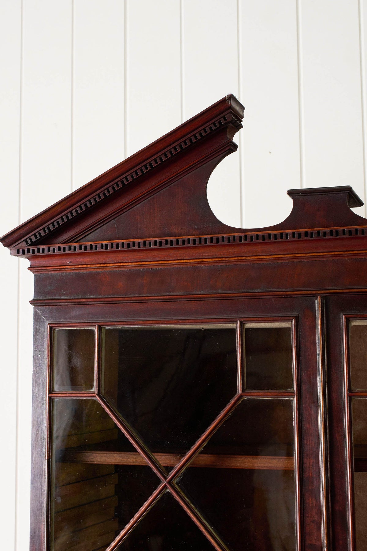 George III Mahogany Glass front Bookcase With Brushing Slide And Greek Key Pediment