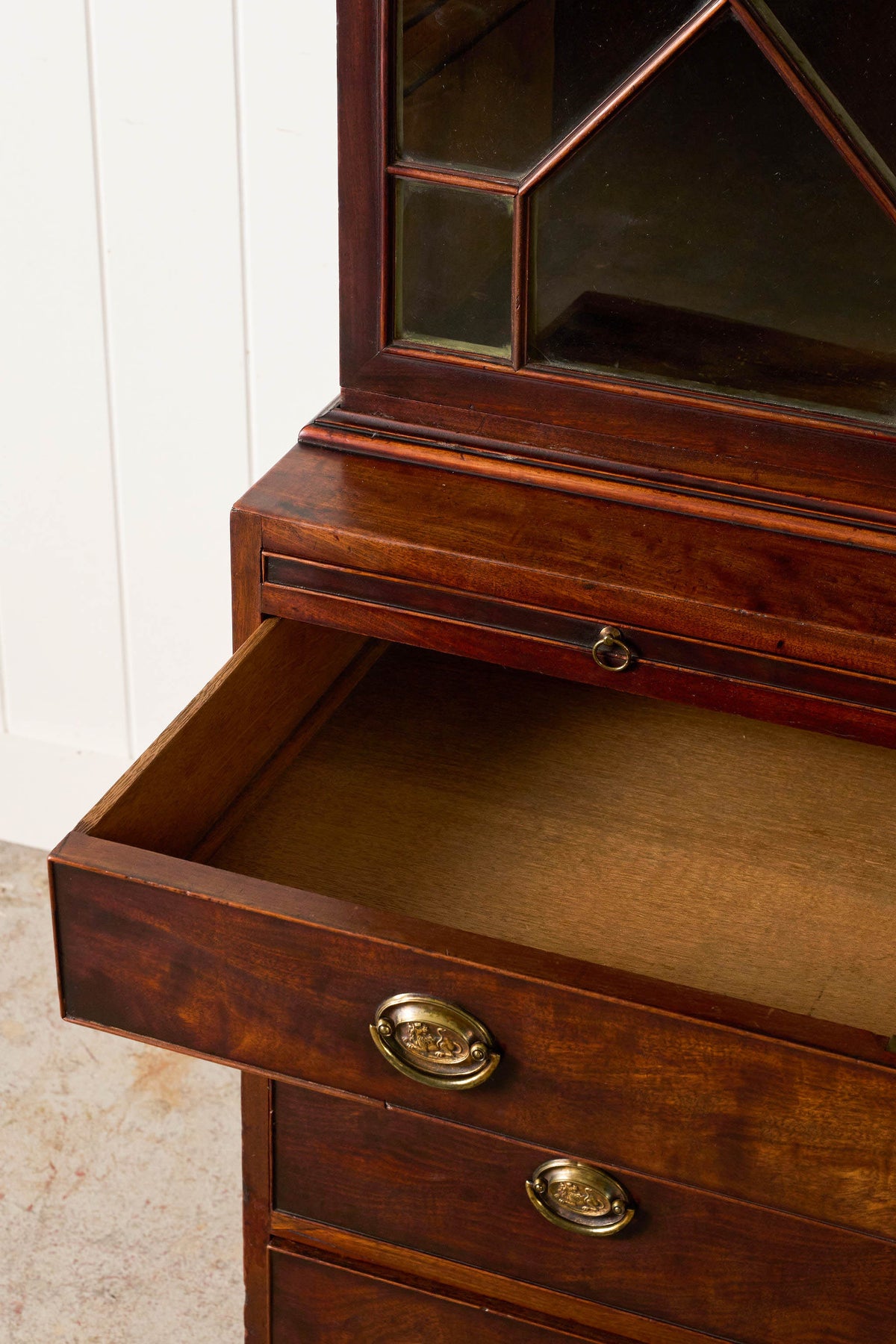 George III Mahogany Glass front Bookcase With Brushing Slide And Greek Key Pediment
