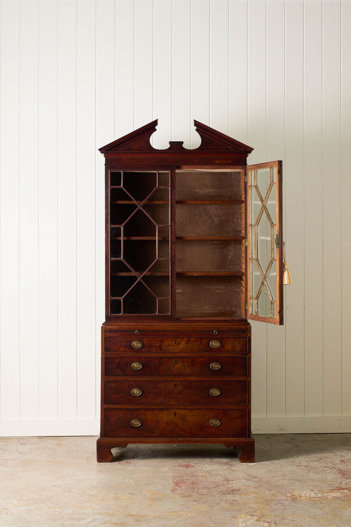 George III Mahogany Glass front Bookcase With Brushing Slide And Greek Key Pediment