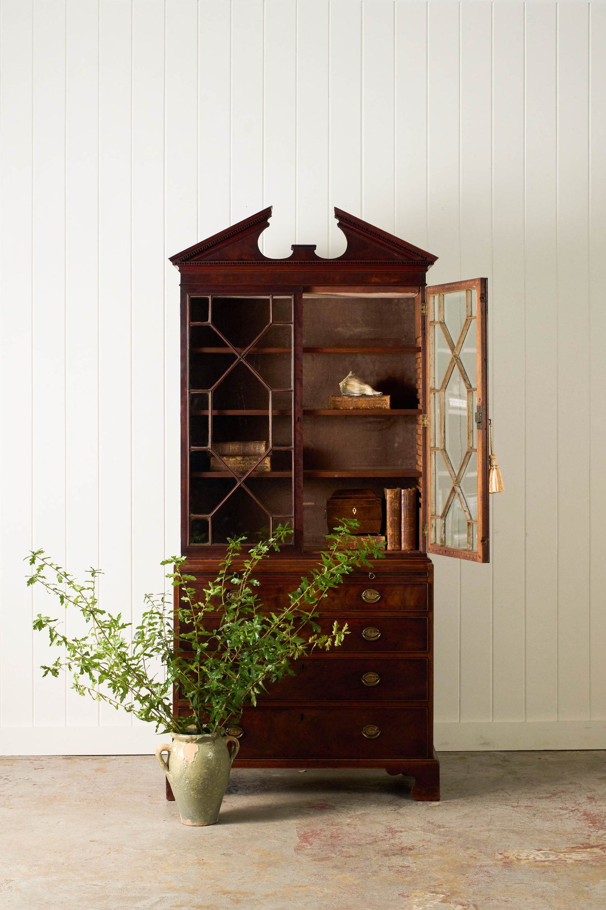 George III Mahogany Glass front Bookcase With Brushing Slide And Greek Key Pediment
