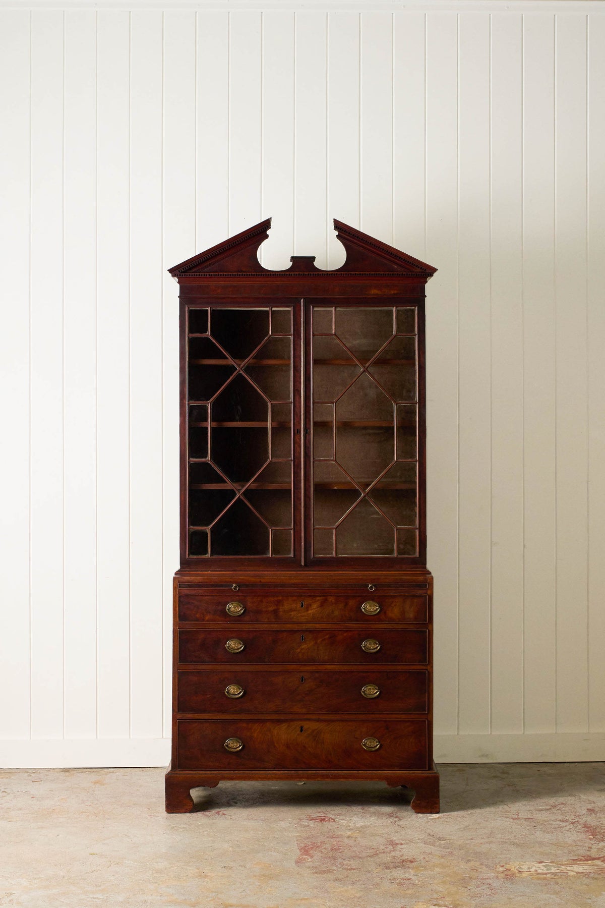 George III Mahogany Glass front Bookcase With Brushing Slide And Greek Key Pediment