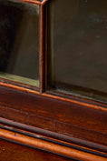 Load image into Gallery viewer, George III Mahogany Glass front Bookcase With Brushing Slide And Greek Key Pediment
