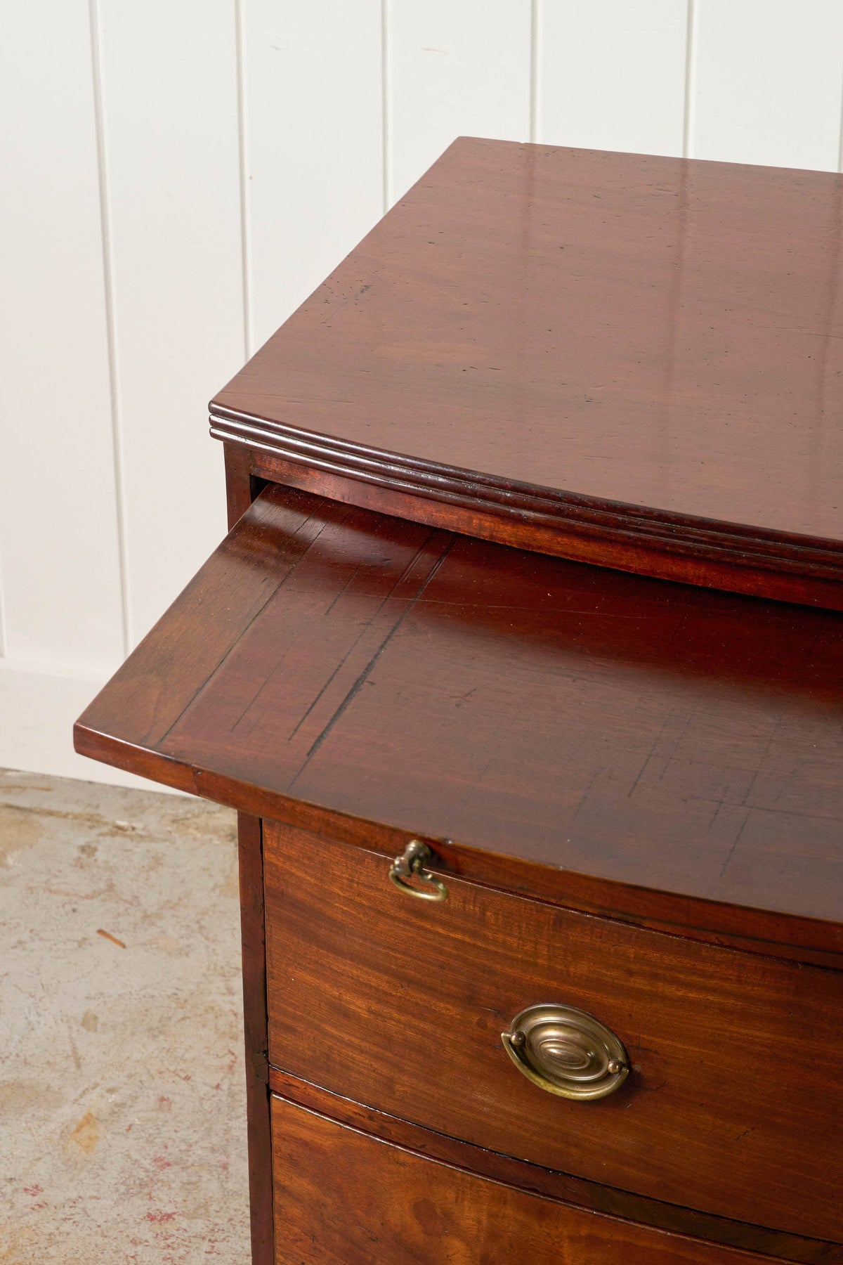 19th Century English Mahogany Bowfront 3-Drawer Chest with Brushing Slide