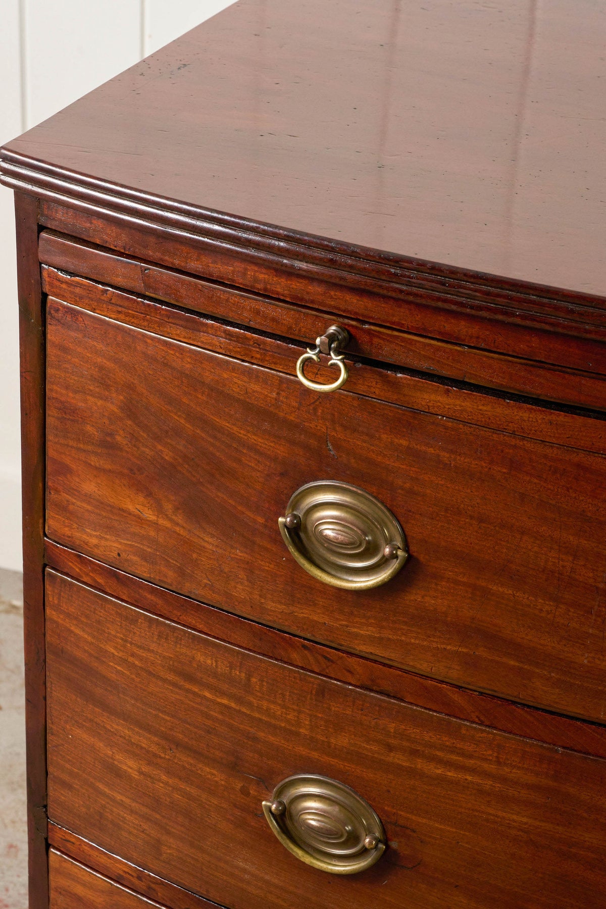 19th Century English Mahogany Bowfront 3-Drawer Chest with Brushing Slide