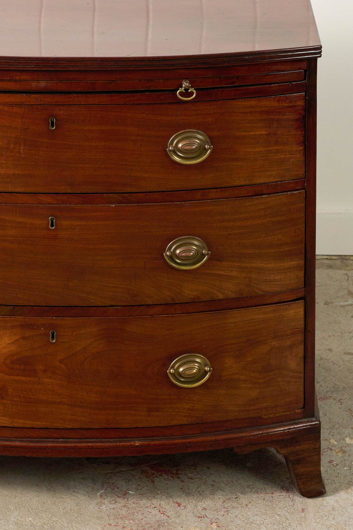 19th Century English Mahogany Bowfront 3-Drawer Chest with Brushing Slide