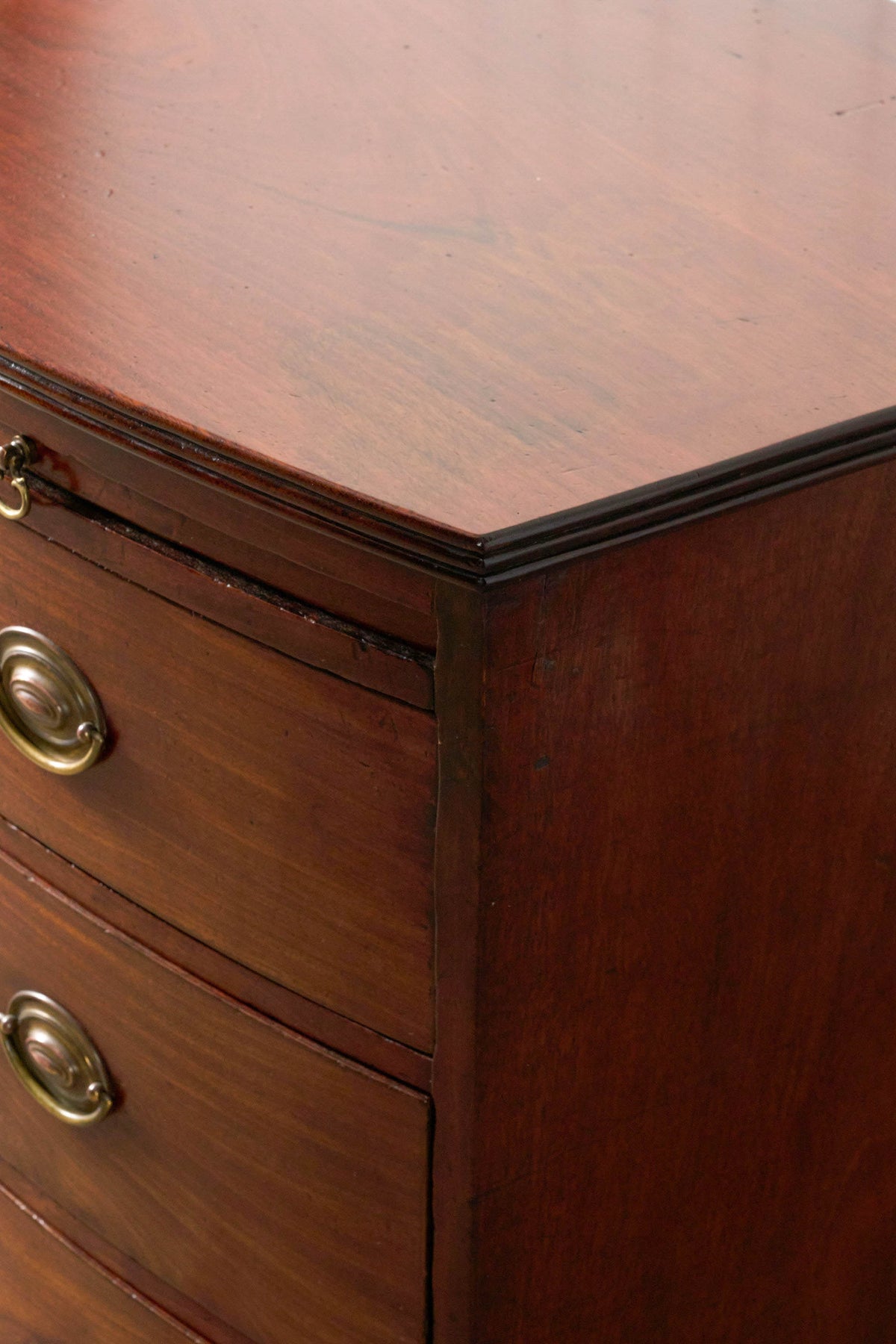 19th Century English Mahogany Bowfront 3-Drawer Chest with Brushing Slide