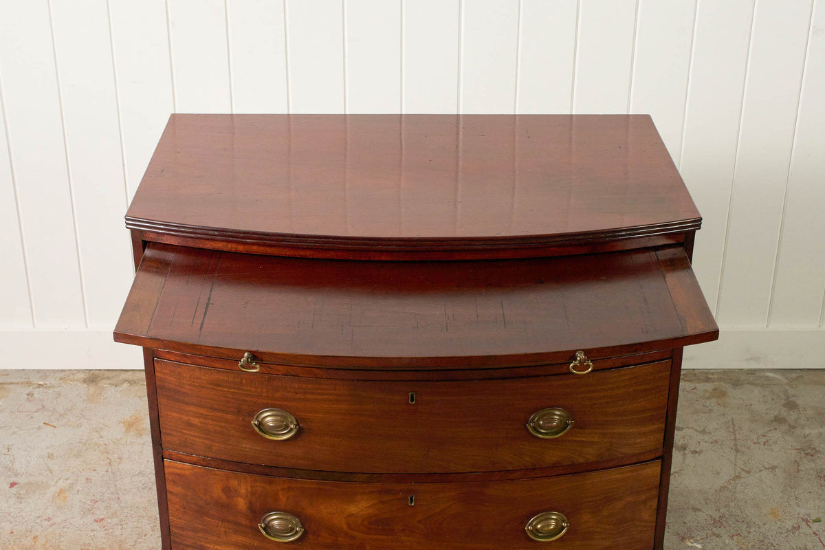 19th Century English Mahogany Bowfront 3-Drawer Chest with Brushing Slide