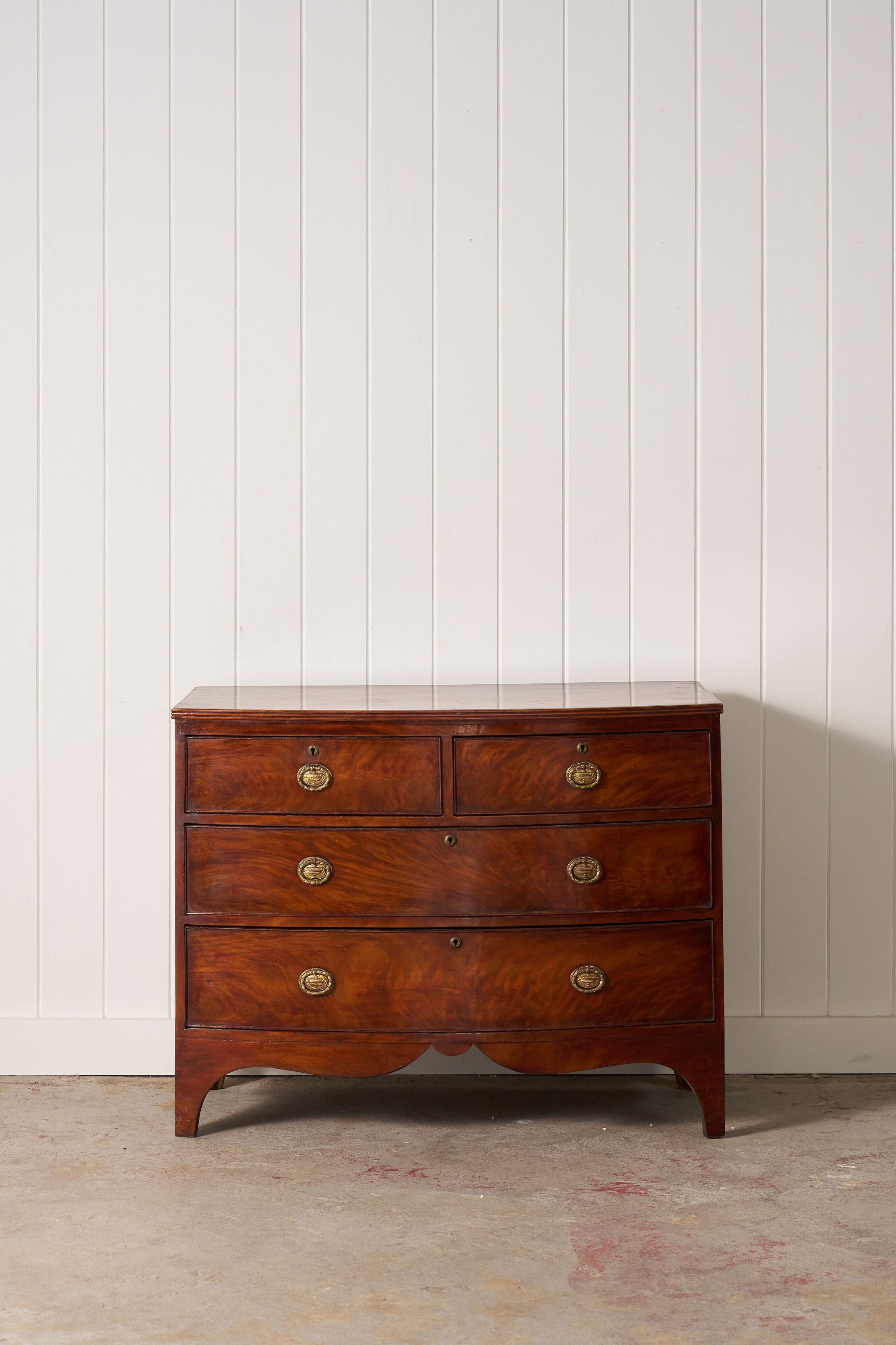 19th Century Victorian Flame Mahogany Bowfront Chest With Urn Hardware