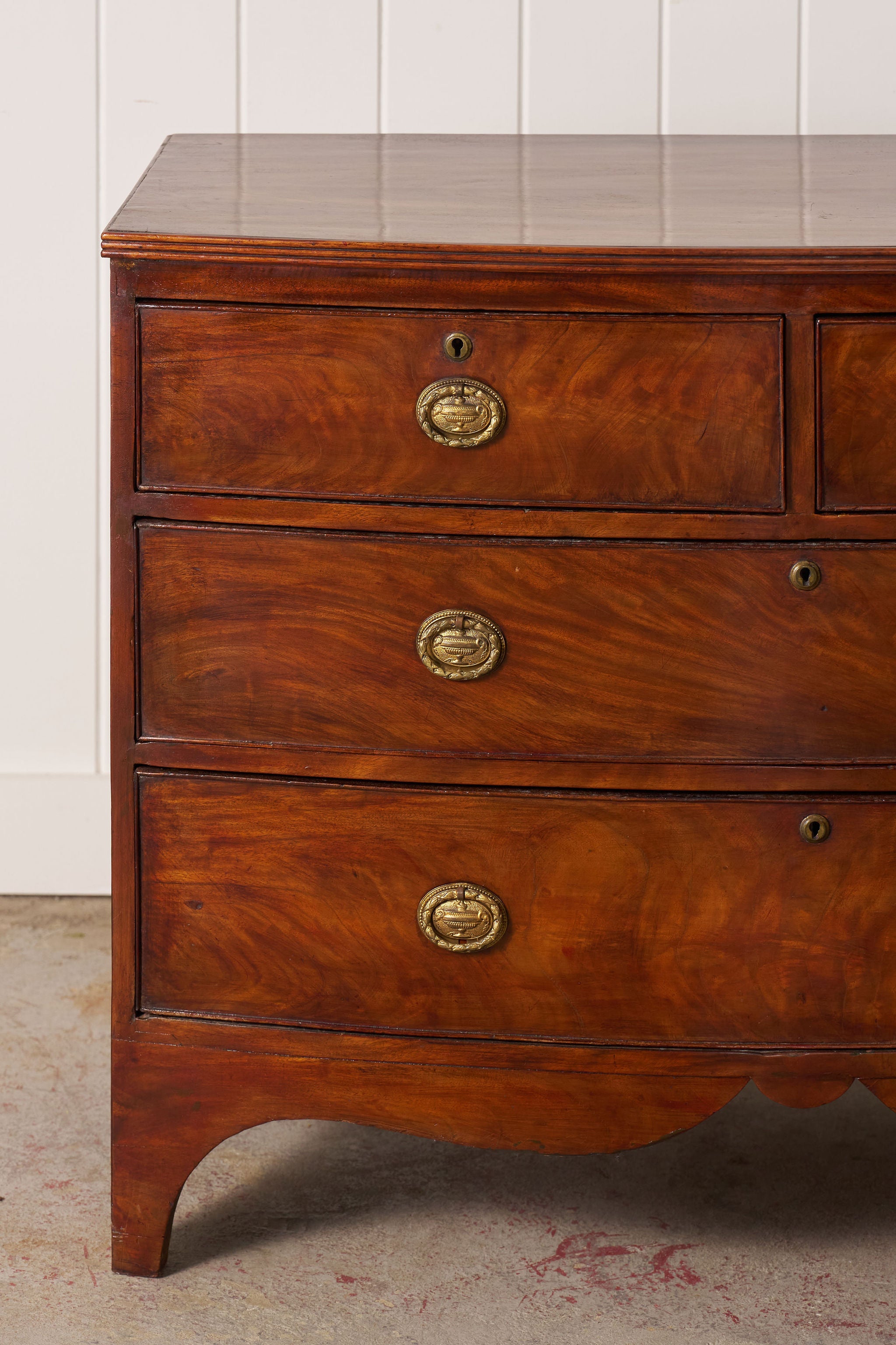 19th Century Victorian Flame Mahogany Bowfront Chest With Urn Hardware