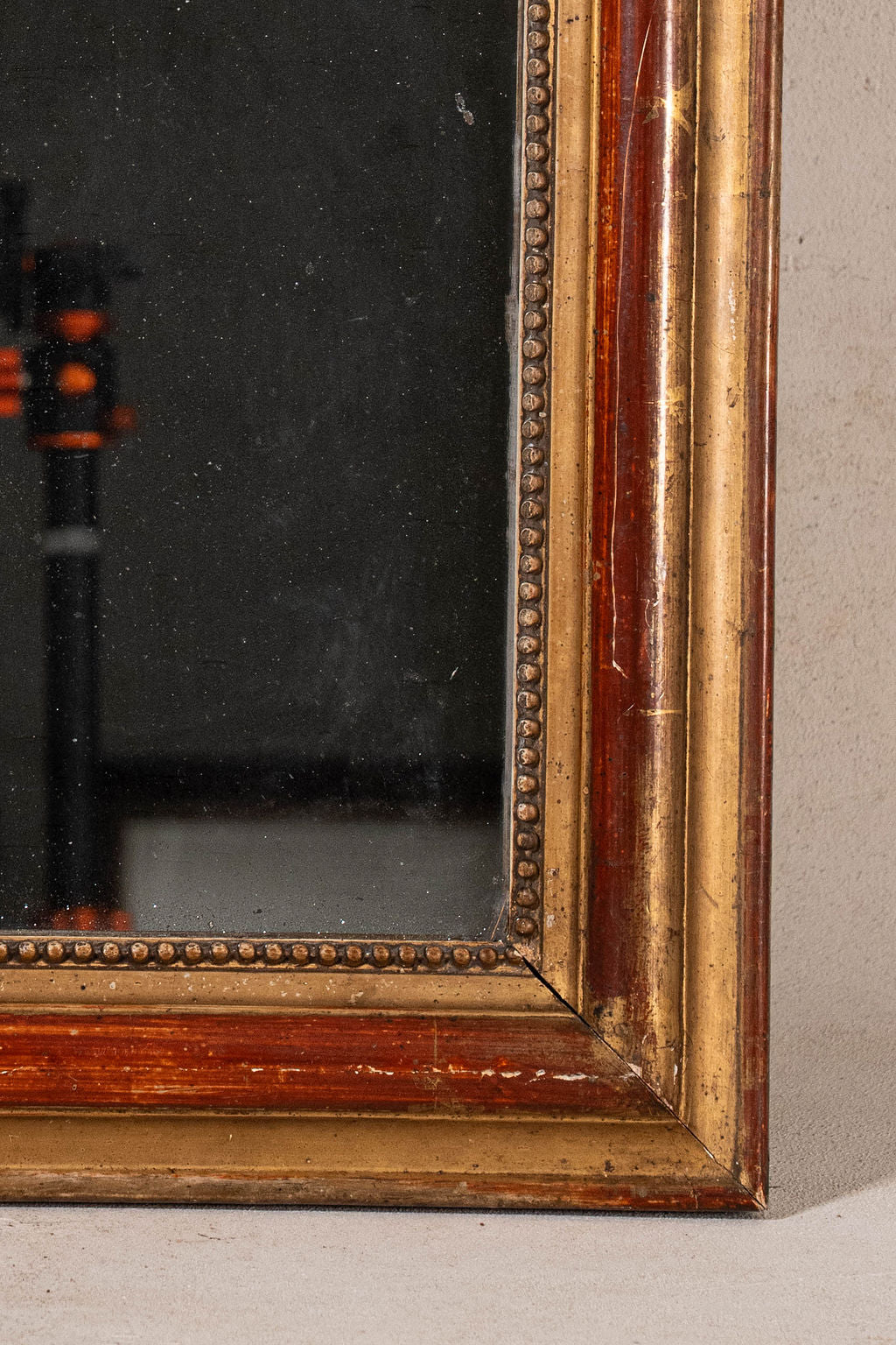 19th Century French Giltwood Mirror with Red Wash + Beaded Inner Detailing