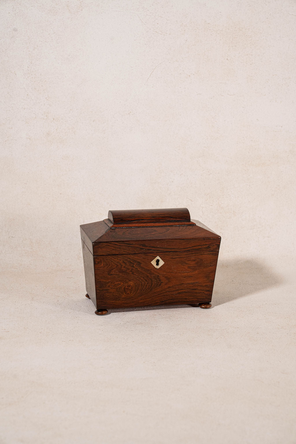 19th Century Rosewood Sarcophagus Tea Caddy with Mother of Pearl Keyhole on Bun Feet