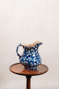 Load image into Gallery viewer, Antique Bulbous Dark Blue Glazed Scalloped Spongeware Pitcher
