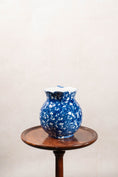 Load image into Gallery viewer, Antique Bulbous Blue Glazed Scalloped Spongeware Pitcher with Floral Relief Detail
