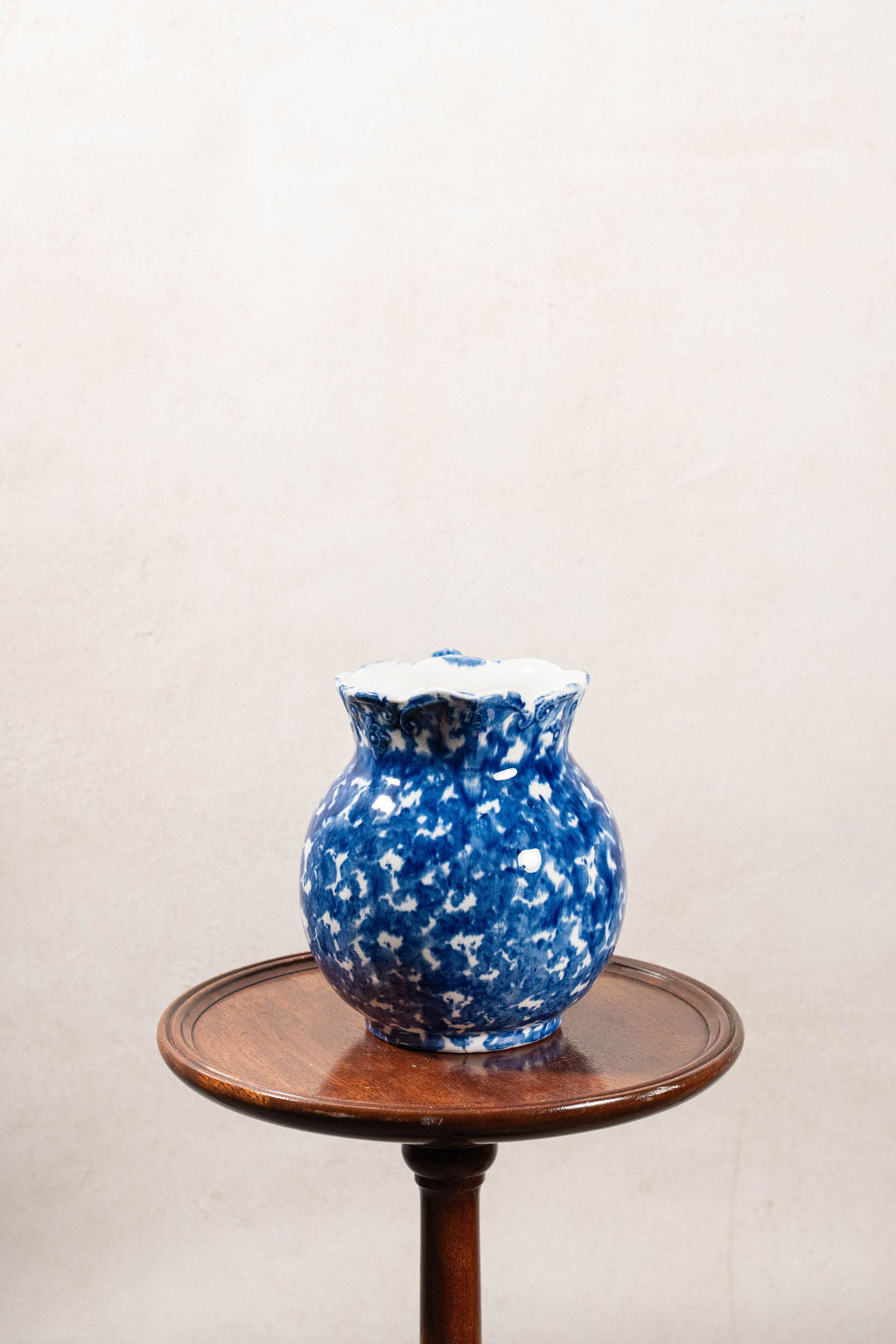 Antique Bulbous Blue Glazed Scalloped Spongeware Pitcher with Floral Relief Detail