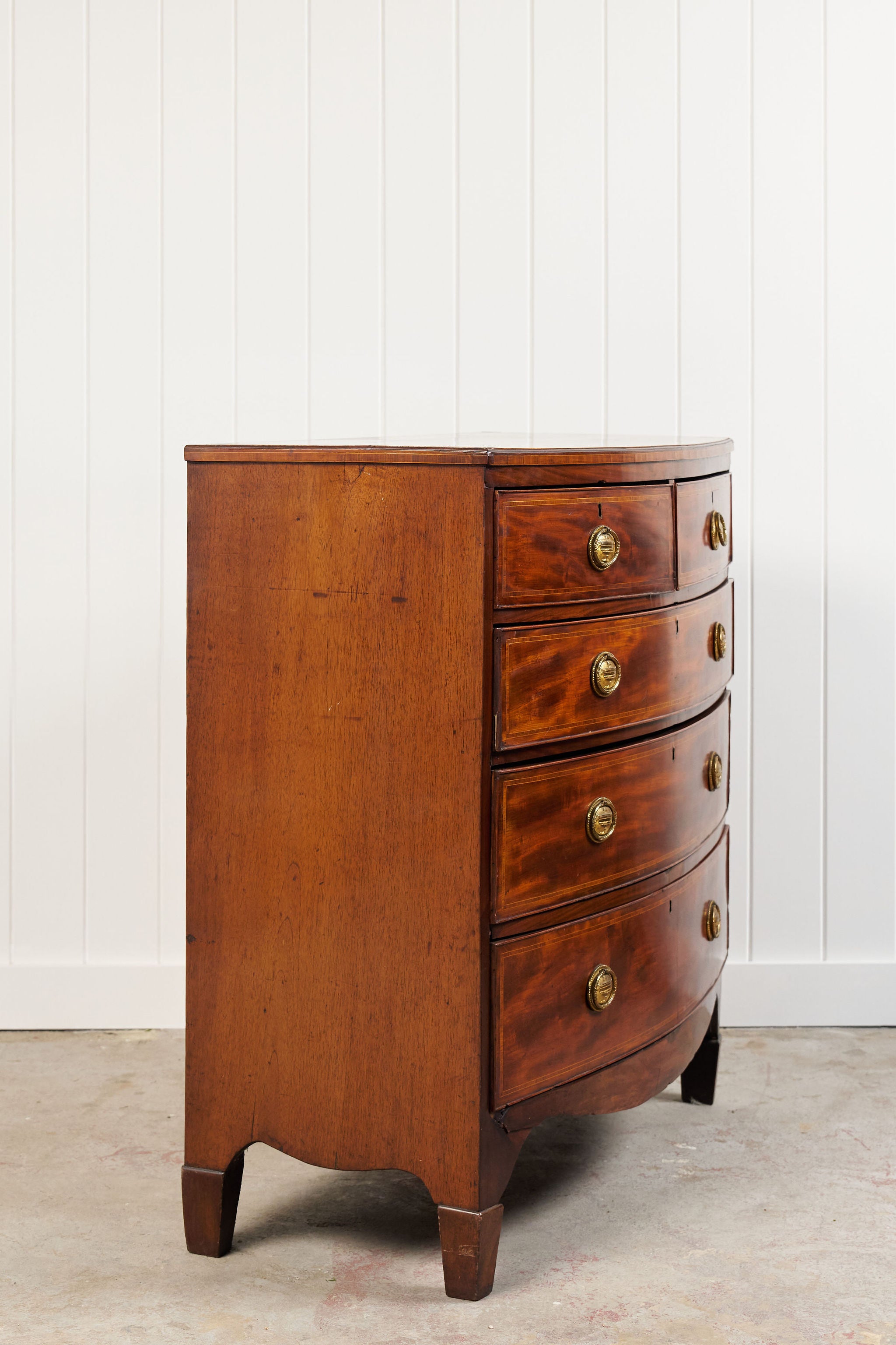 19th Century English Bowfront Chest with Urn Motif Oval Hardware