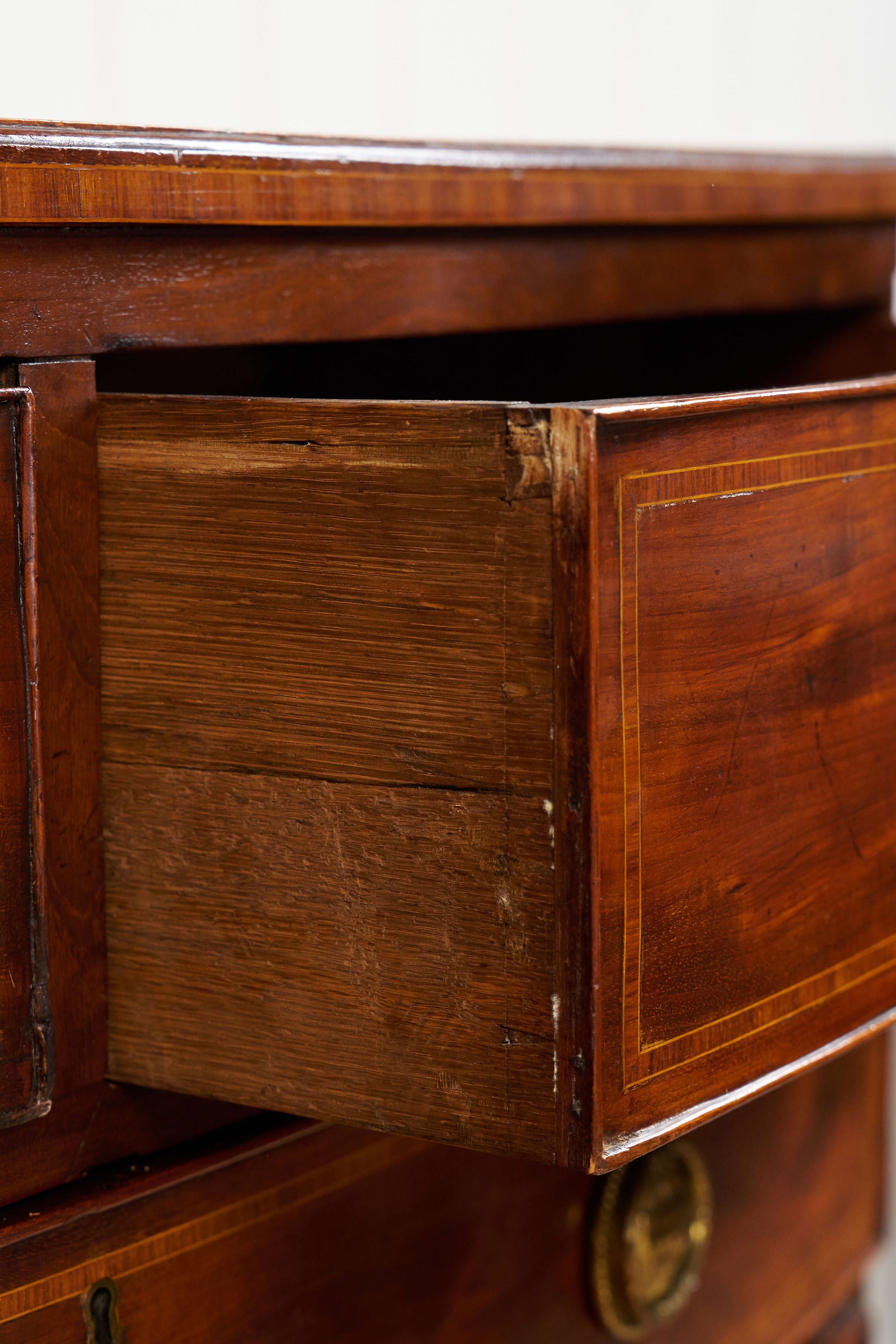 19th Century English Bowfront Chest with Urn Motif Oval Hardware