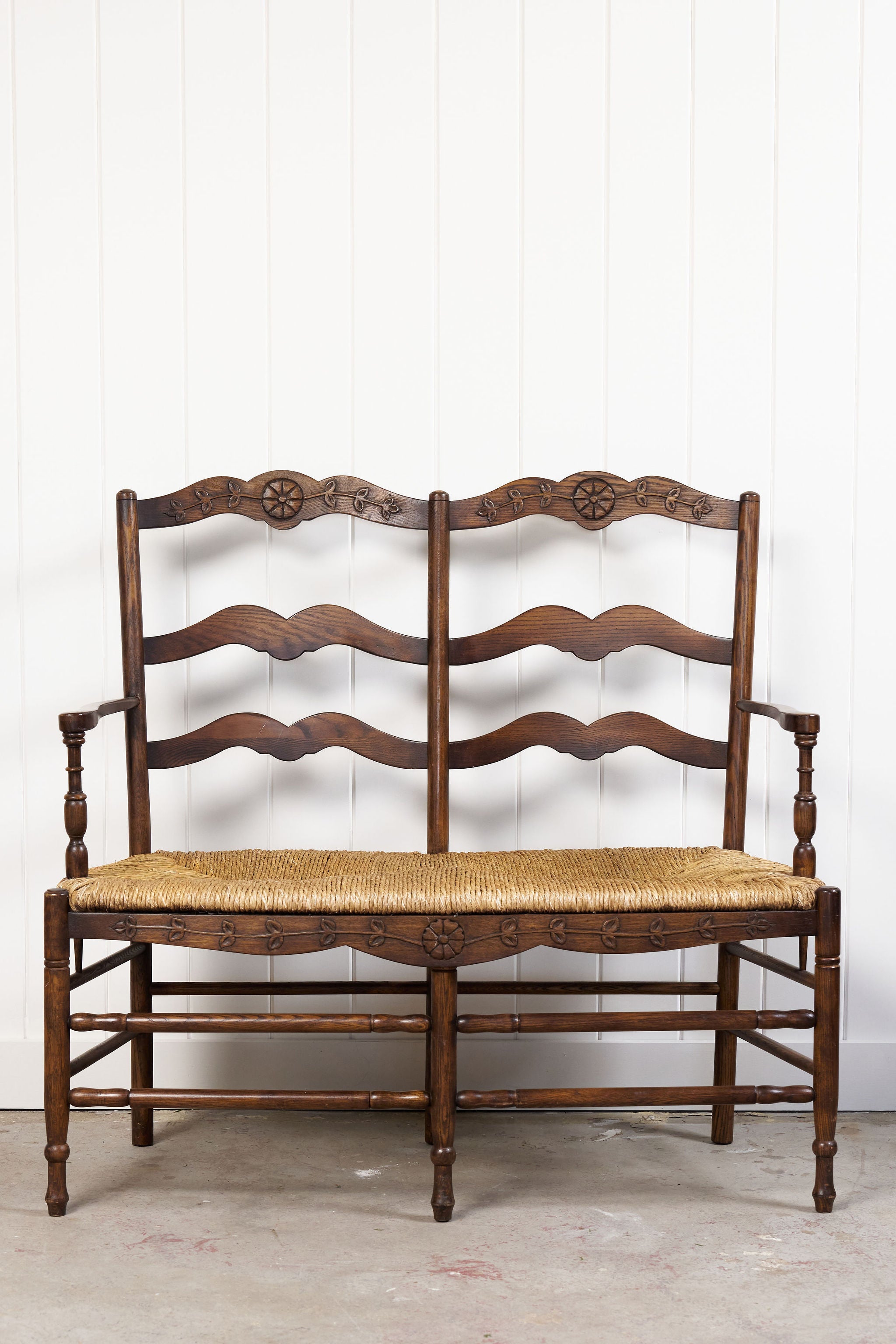Vintage Oak Settee with Rush Seat + Floral Wood Carvings