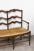 Load image into Gallery viewer, Vintage Oak Settee with Rush Seat + Floral Wood Carvings
