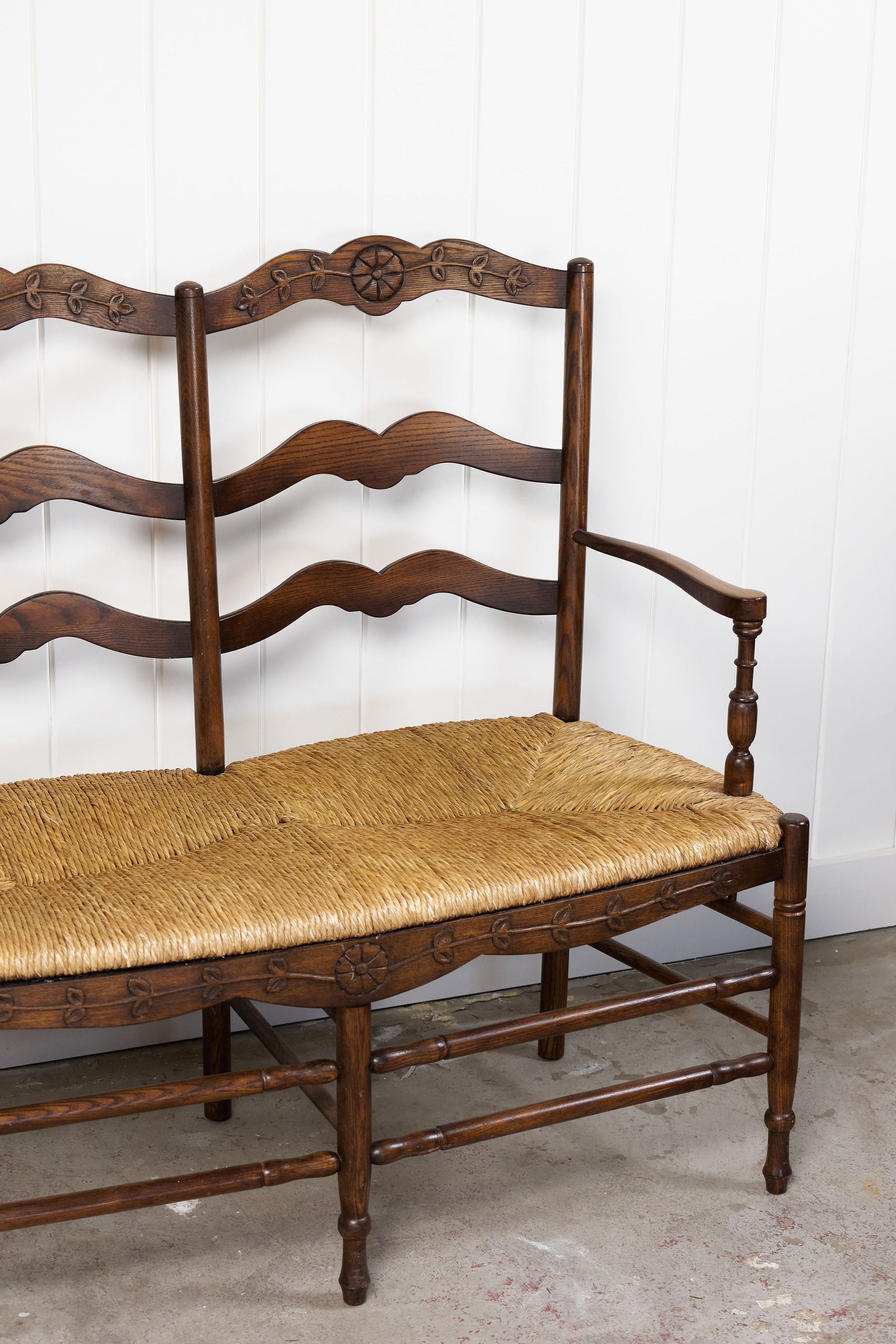 Vintage Oak Settee with Rush Seat + Floral Wood Carvings