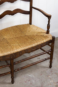 Load image into Gallery viewer, Vintage Oak Settee with Rush Seat + Floral Wood Carvings

