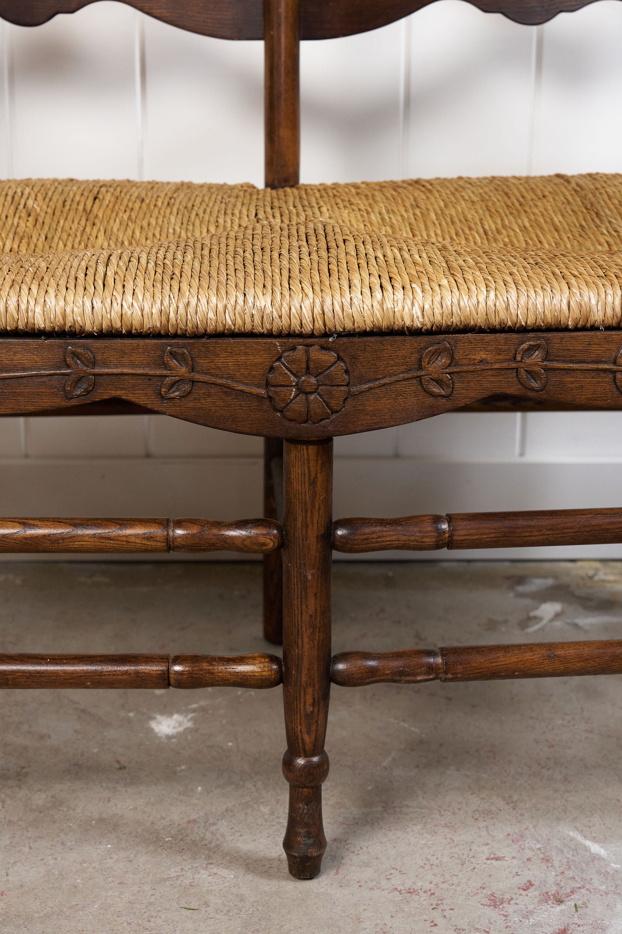 Vintage Oak Settee with Rush Seat + Floral Wood Carvings