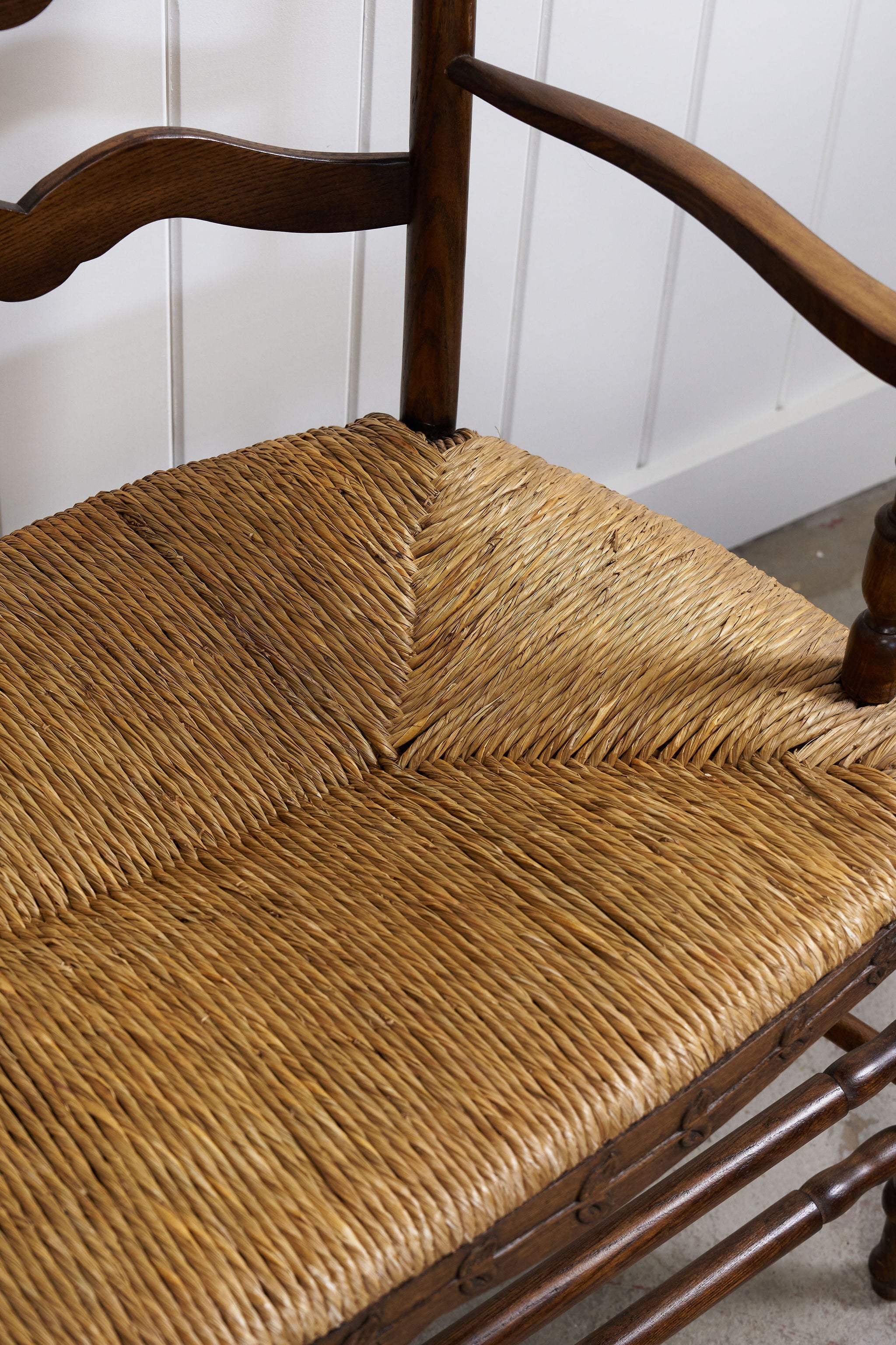 Vintage Oak Settee with Rush Seat + Floral Wood Carvings