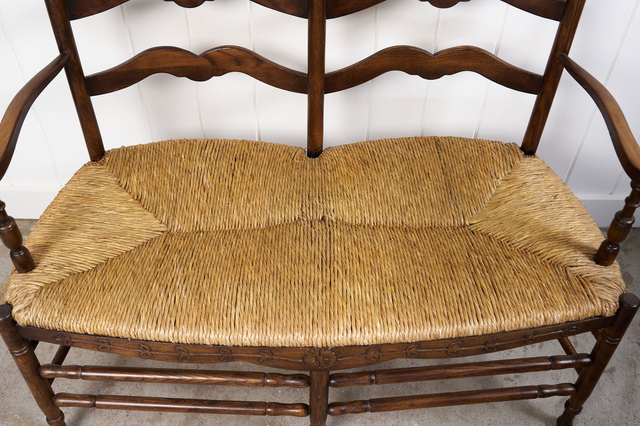 Vintage Oak Settee with Rush Seat + Floral Wood Carvings