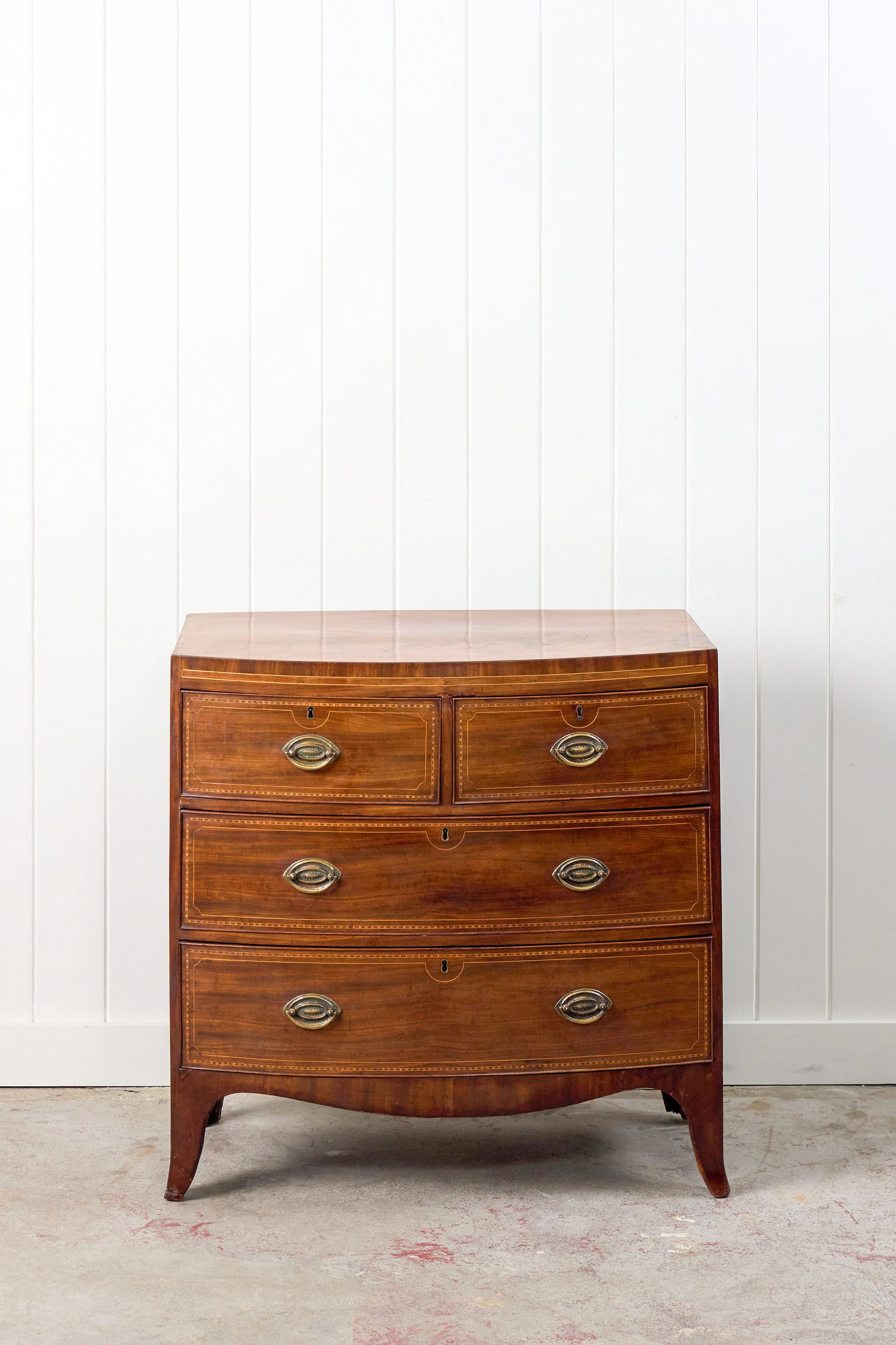 19th Century Mahogany Bowfront Chest with Satinwood Inlay on Splay Feet (c. 1810)
