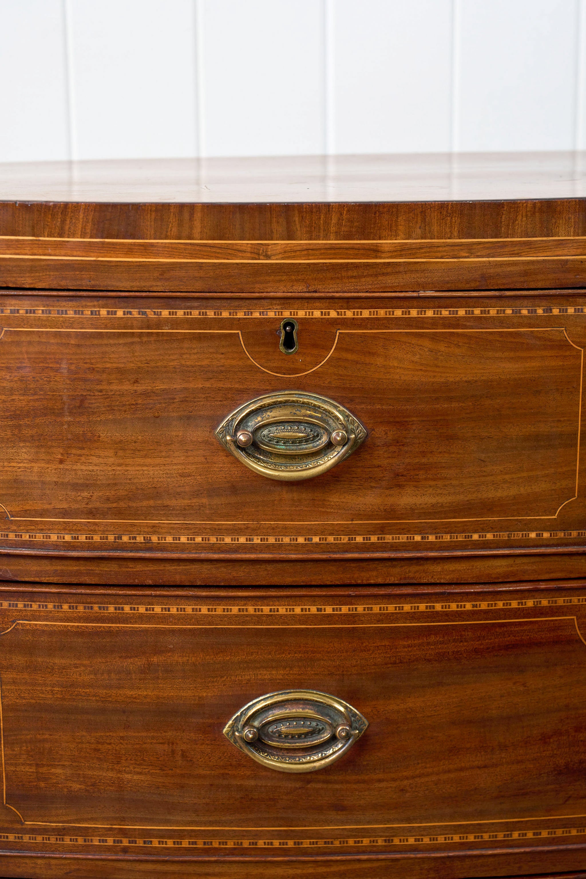 19th Century Mahogany Bowfront Chest with Satinwood Inlay on Splay Feet (c. 1810)