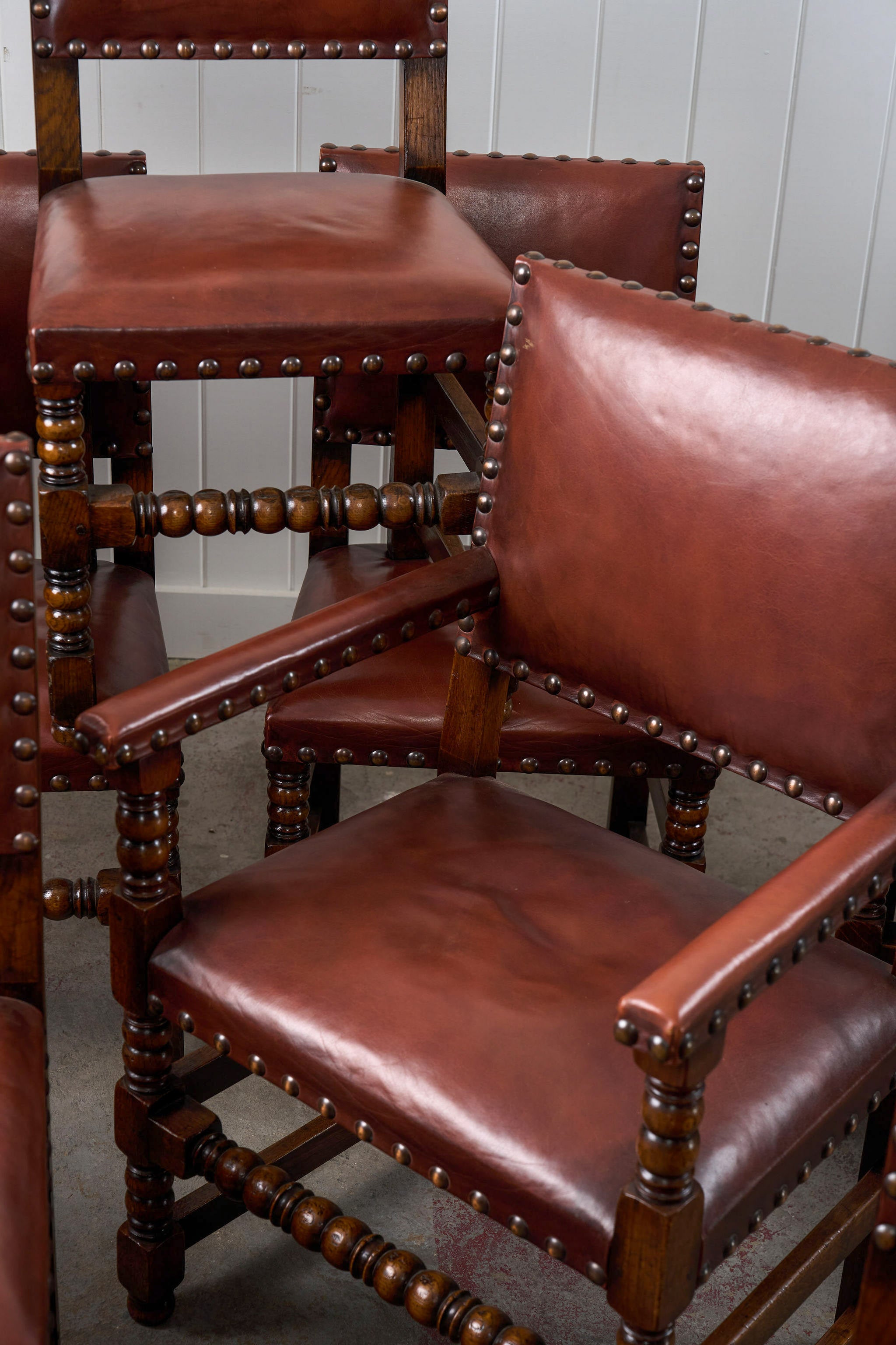 SET of 10 | English Cromwellian Style Oak Bobbin Stretcher Base Dining Chairs with Leather Upholstery (c. 1920)